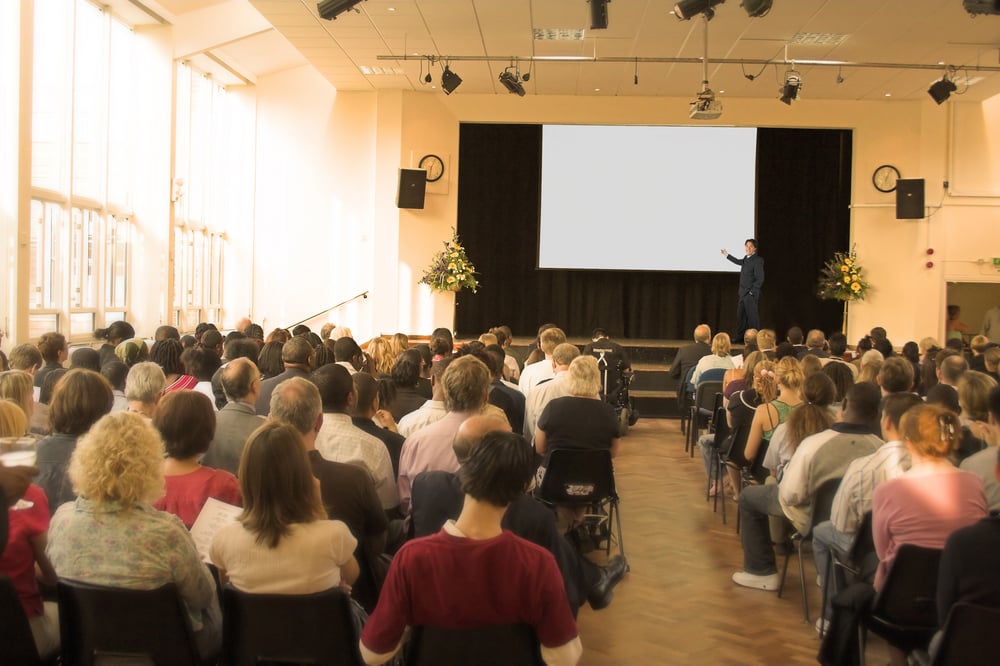 business man giving a conference in a room