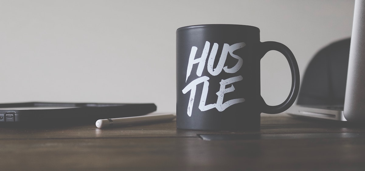 "hustle" word on mug